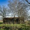 A frontal view of this long abandoned home.