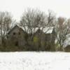 Ominous long abandoned 
farm house in Pierce County.